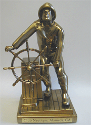 Bronze statue of a sailor at the helm