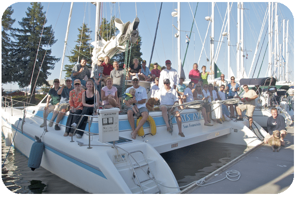 Bunch of people sitting on a catamaran