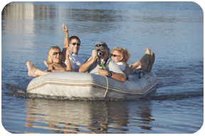 Four people on an inflatable dinghy