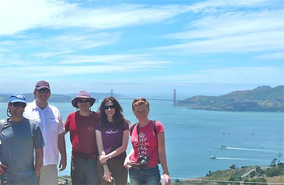 Five people standing on Angel Island with the Golden Gate Bridge in the background